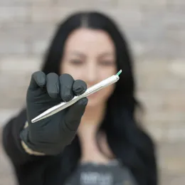 Sarah Delaney holding microblading tool