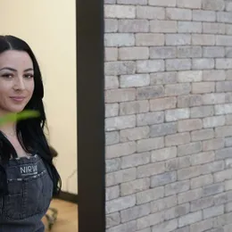 Sarah Delaney professional headshot with Nirvana apron